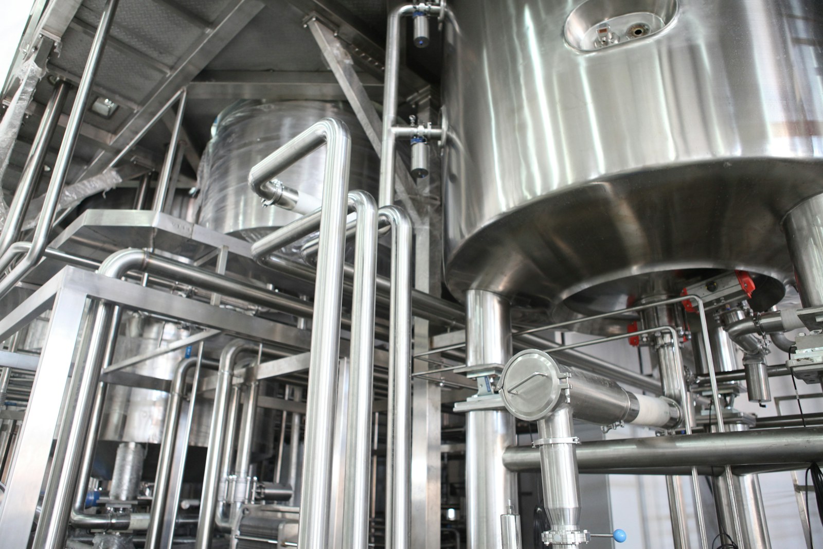 Modern stainless-steel industrial equipment in a professional food-processing environment